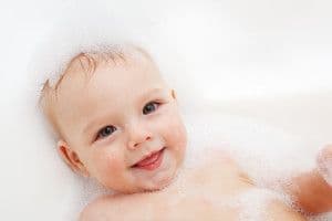 Baby with bubbles in bath