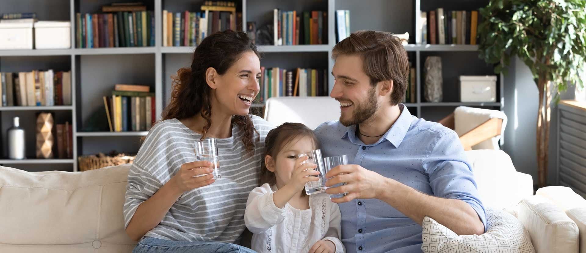 Family Laughing holding water